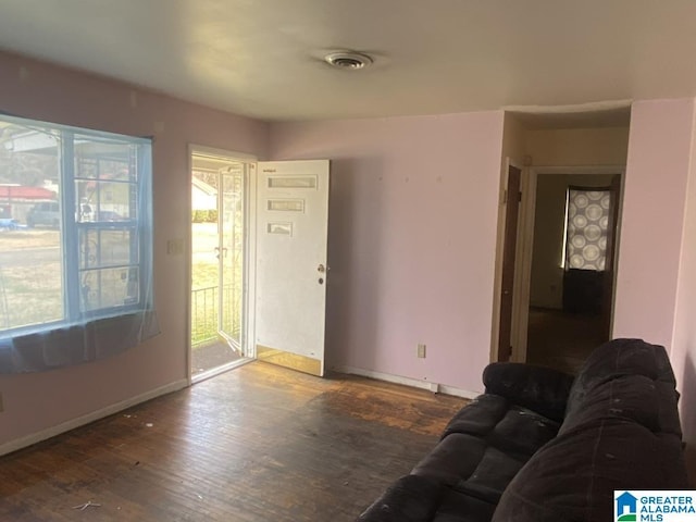 living room featuring dark hardwood / wood-style flooring