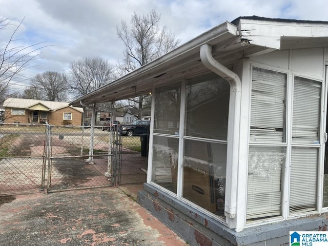 view of side of property featuring a sunroom