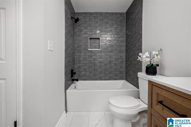 full bathroom with tiled shower / bath, vanity, and toilet