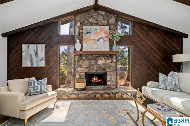 living room with a fireplace, wooden walls, and vaulted ceiling with beams