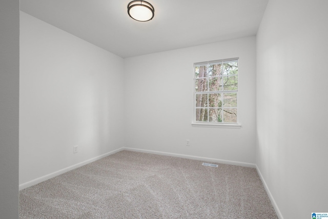 empty room featuring carpet flooring