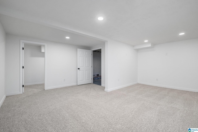 basement with light colored carpet