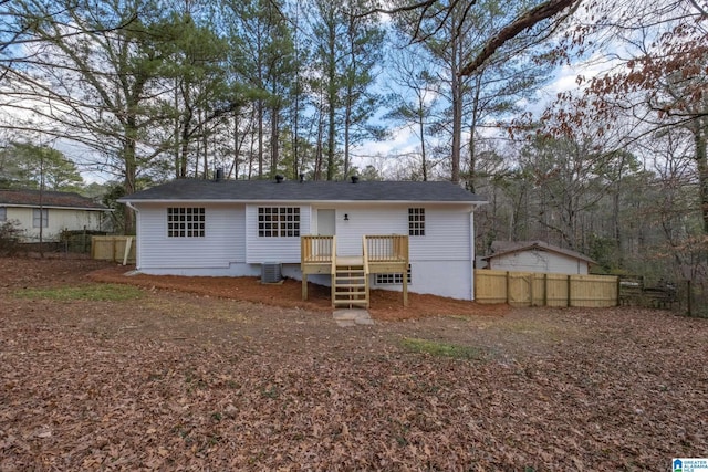 rear view of house with central AC