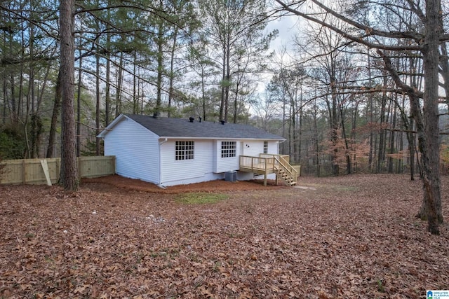 back of property featuring central air condition unit