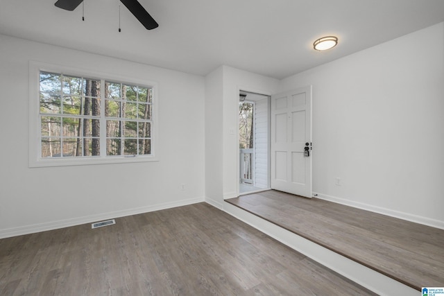 empty room featuring hardwood / wood-style floors and ceiling fan