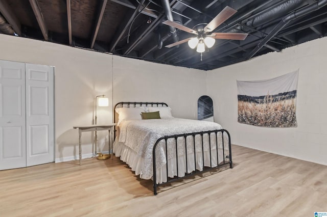 bedroom with hardwood / wood-style flooring and ceiling fan