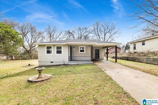 view of front of house with a front yard and a carport