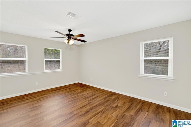 empty room featuring ceiling fan and wood-type flooring