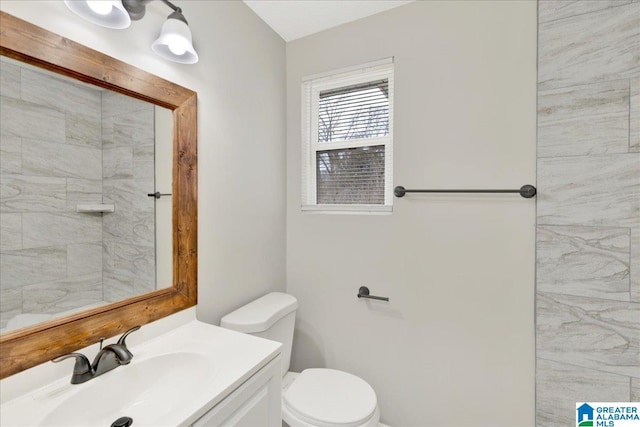 bathroom featuring vanity and toilet