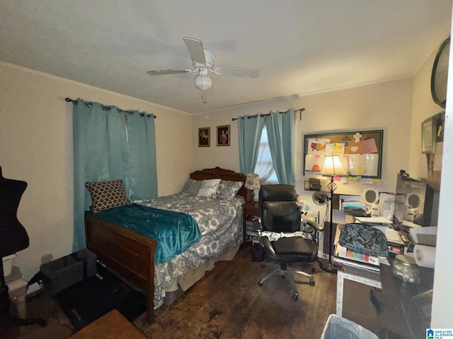 bedroom featuring ceiling fan, ornamental molding, and wood finished floors