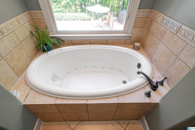 bathroom with tiled bath