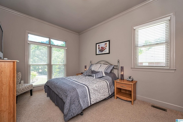 carpeted bedroom featuring ornamental molding