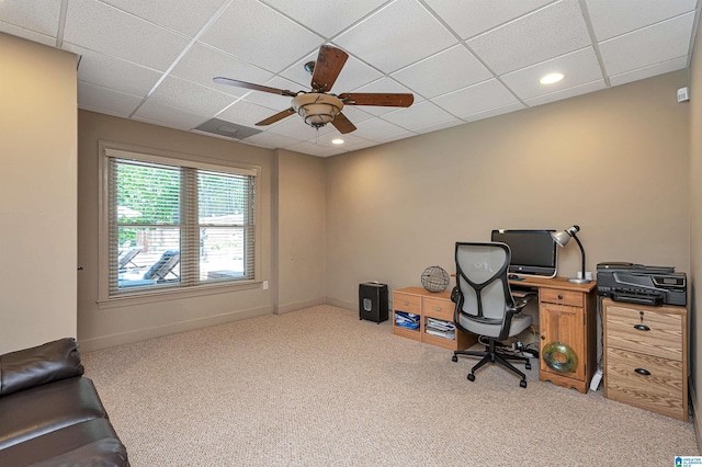 office space featuring ceiling fan, light colored carpet, and a paneled ceiling