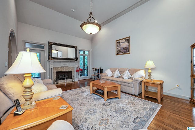 living room with crown molding and hardwood / wood-style floors