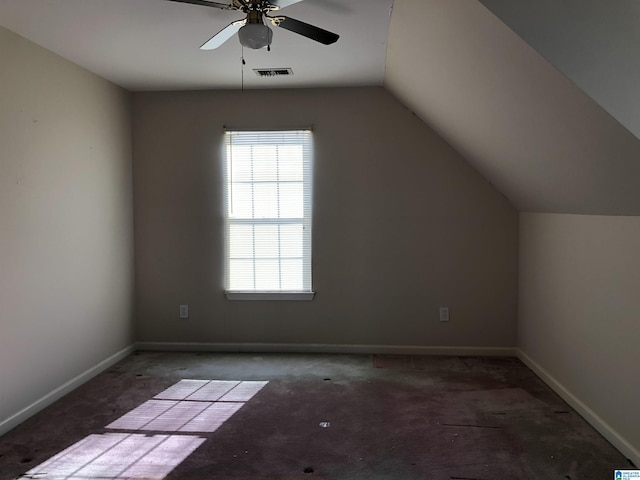 additional living space featuring ceiling fan, lofted ceiling, and carpet floors