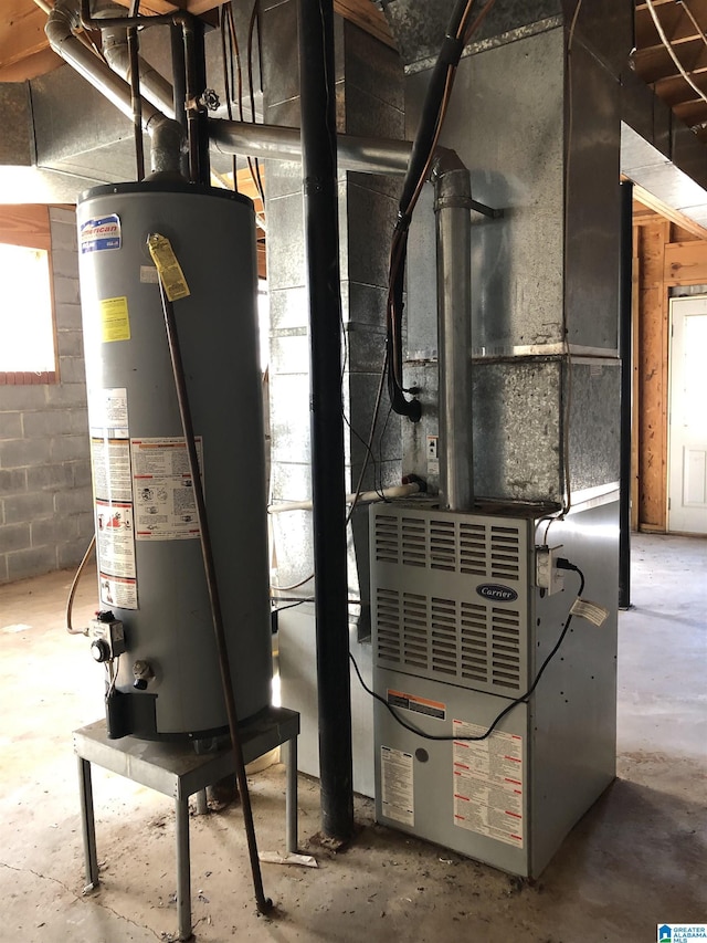 utility room with heating unit and gas water heater