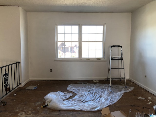 empty room with a textured ceiling