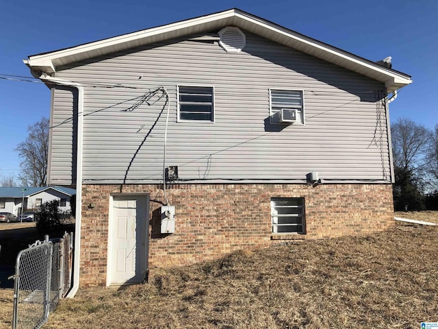 view of side of property with a lawn