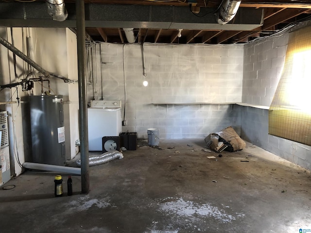 basement featuring washer / clothes dryer and water heater