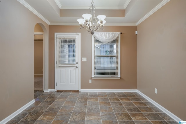 entryway featuring baseboards, a raised ceiling, arched walkways, and an inviting chandelier