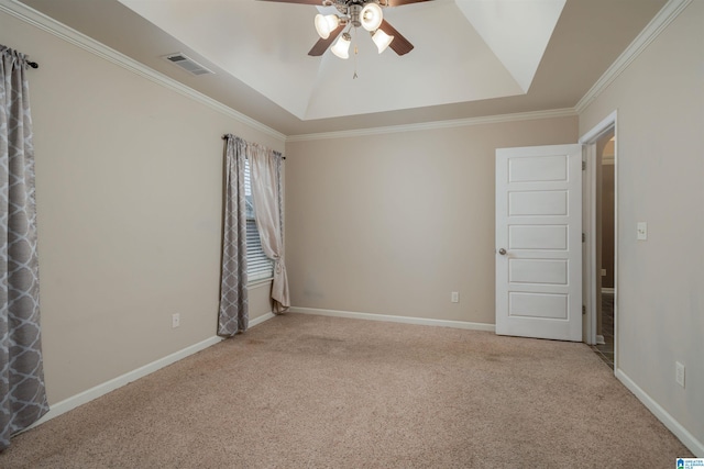 unfurnished room featuring visible vents, baseboards, a tray ceiling, and carpet