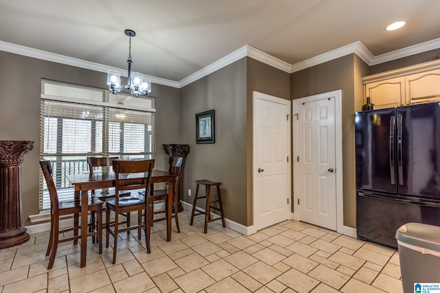 dining space featuring an inviting chandelier and ornamental molding