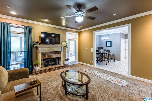 carpeted living room featuring a fireplace, ornamental molding, and ceiling fan with notable chandelier