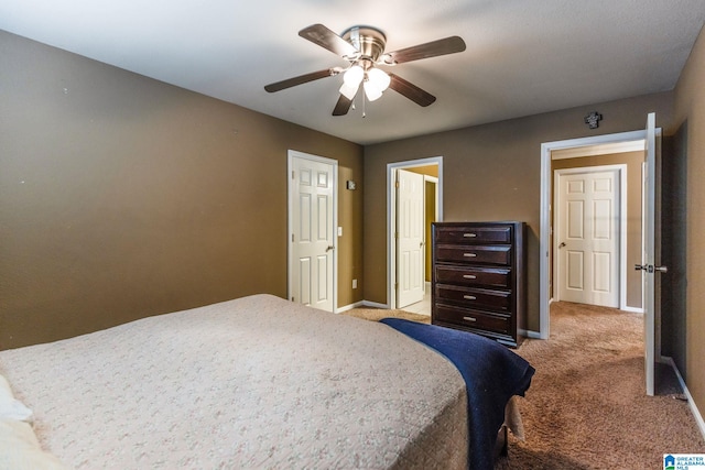 carpeted bedroom featuring ceiling fan