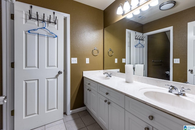 bathroom featuring tile patterned flooring and vanity