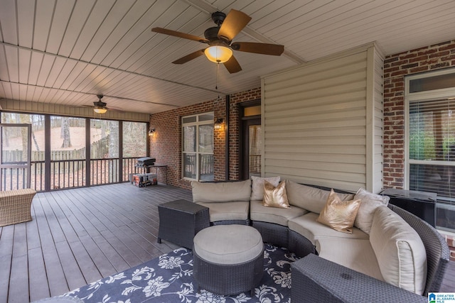 deck featuring an outdoor hangout area and ceiling fan