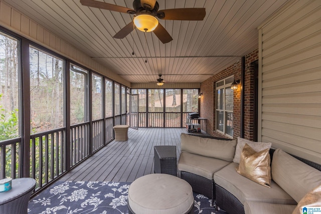 unfurnished sunroom with plenty of natural light and wood ceiling