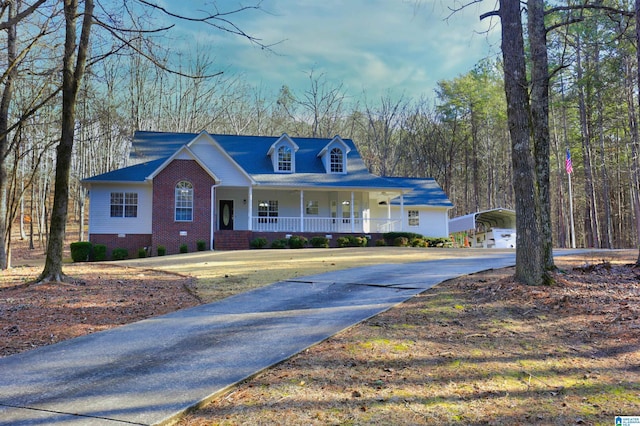 view of front of home with a carport and covered porch