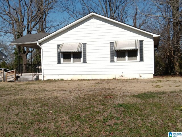 view of home's exterior featuring a yard