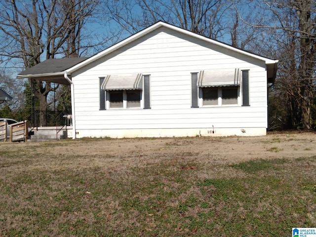 view of home's exterior featuring a yard