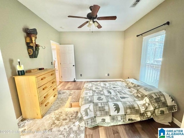 bedroom with ceiling fan and light hardwood / wood-style floors