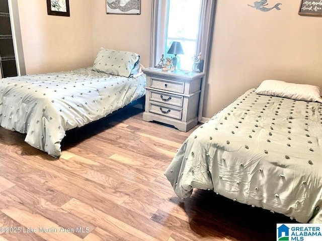 bedroom with light wood-type flooring