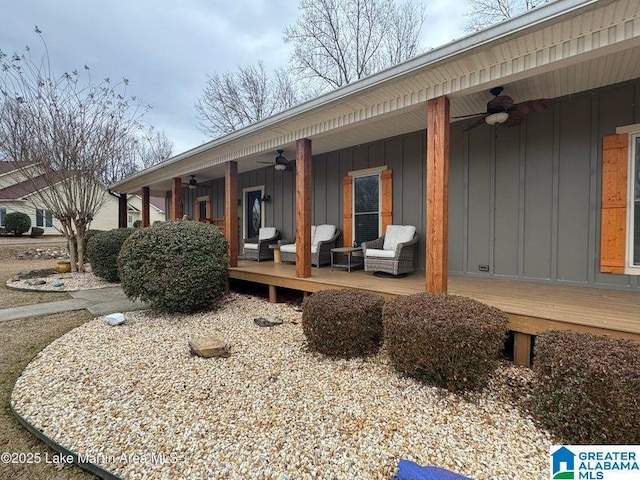 view of home's exterior with a deck and ceiling fan