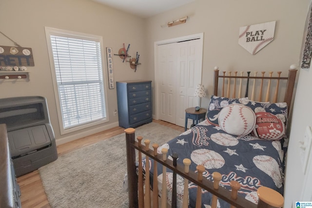 bedroom featuring hardwood / wood-style flooring and a closet