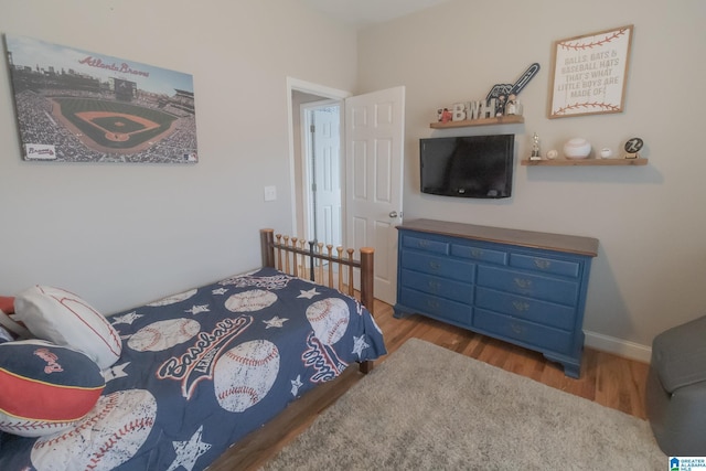 bedroom featuring wood-type flooring