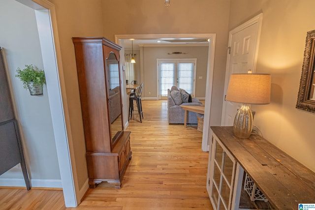 hall with light hardwood / wood-style flooring