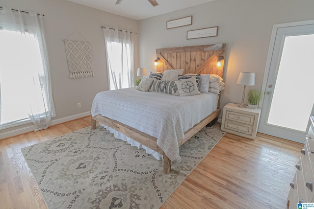 bedroom with ceiling fan and light hardwood / wood-style flooring