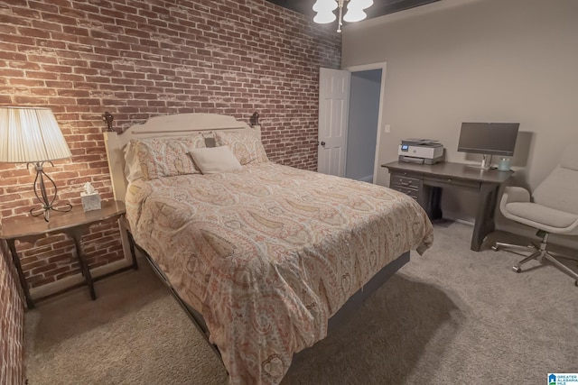 bedroom with carpet and brick wall