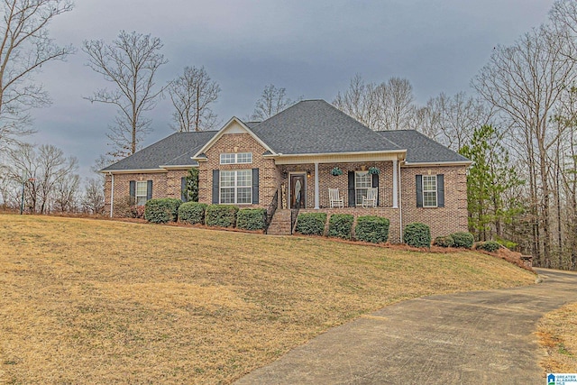 view of front of house featuring a front yard and covered porch