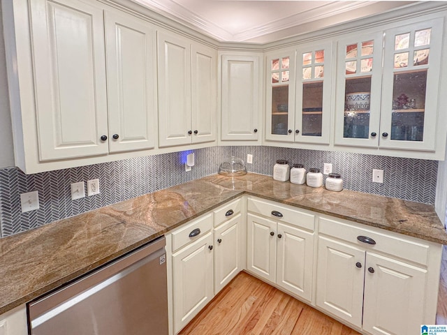 kitchen featuring dishwasher, backsplash, light stone counters, light hardwood / wood-style floors, and white cabinets