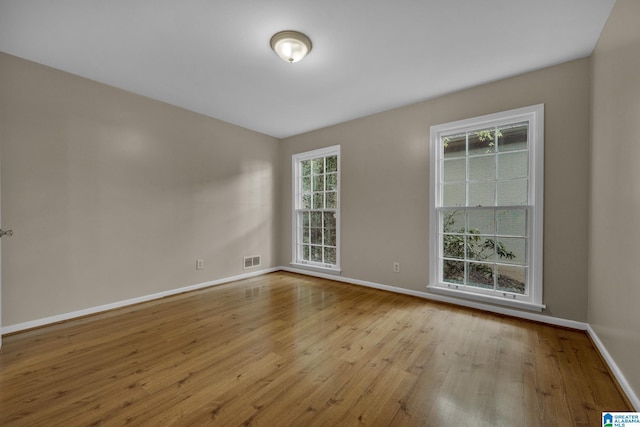 spare room with light wood-type flooring