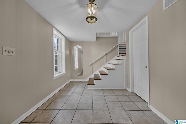 foyer entrance with light tile patterned floors