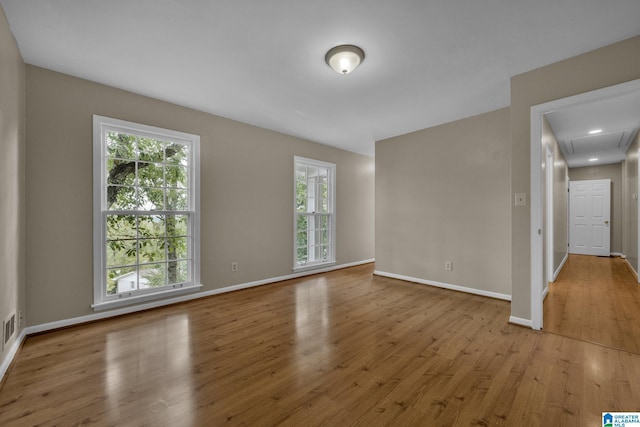 empty room with light hardwood / wood-style floors