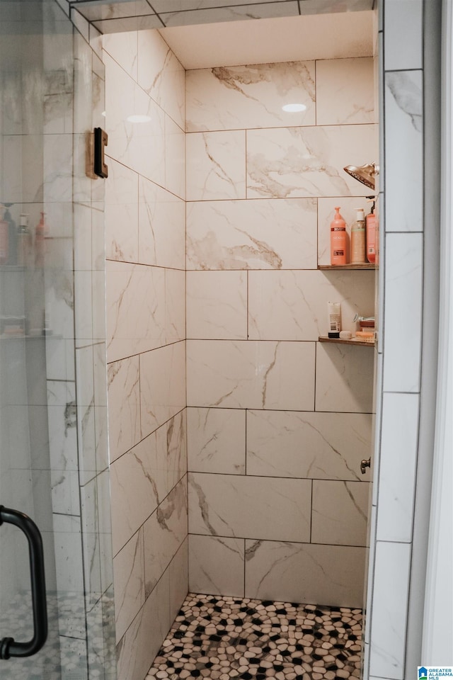 bathroom featuring an enclosed shower