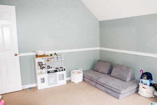 living room featuring vaulted ceiling and carpet