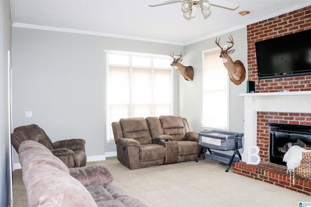 living room featuring crown molding, a brick fireplace, carpet floors, and ceiling fan